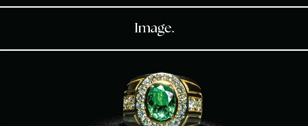 Oval-Cut Emerald Ring with Diamond Halo and Wide Tapered Band in Yellow Gold